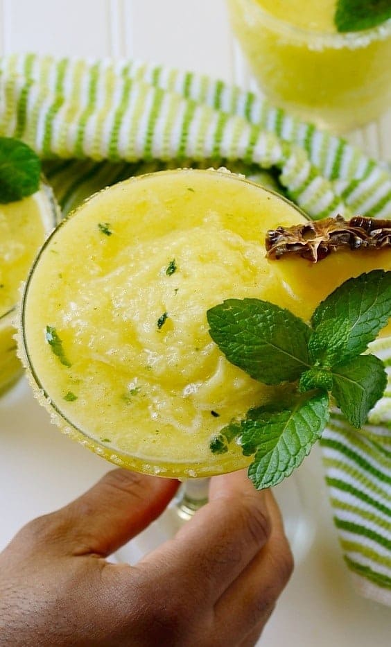 A close up of pineapple chilled cocktail