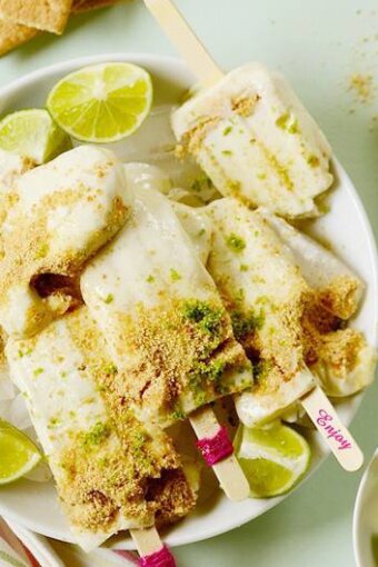 A plate of several lime popsicles