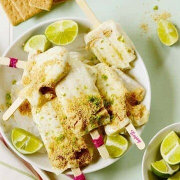 A plate of several lime popsicles