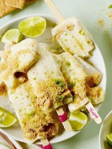 A plate of several lime popsicles