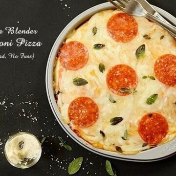 A  round pepperoni pizza in a metal pan
