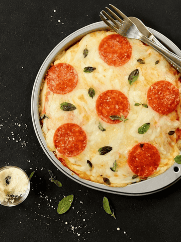 Pepperoni pizza with melted mozzarella and fresh oregano.