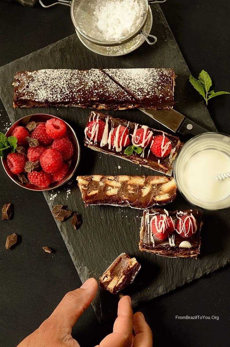 Chocolate Fudge and Cookie Bars (Palha Italiana) with a cup of milk on the side