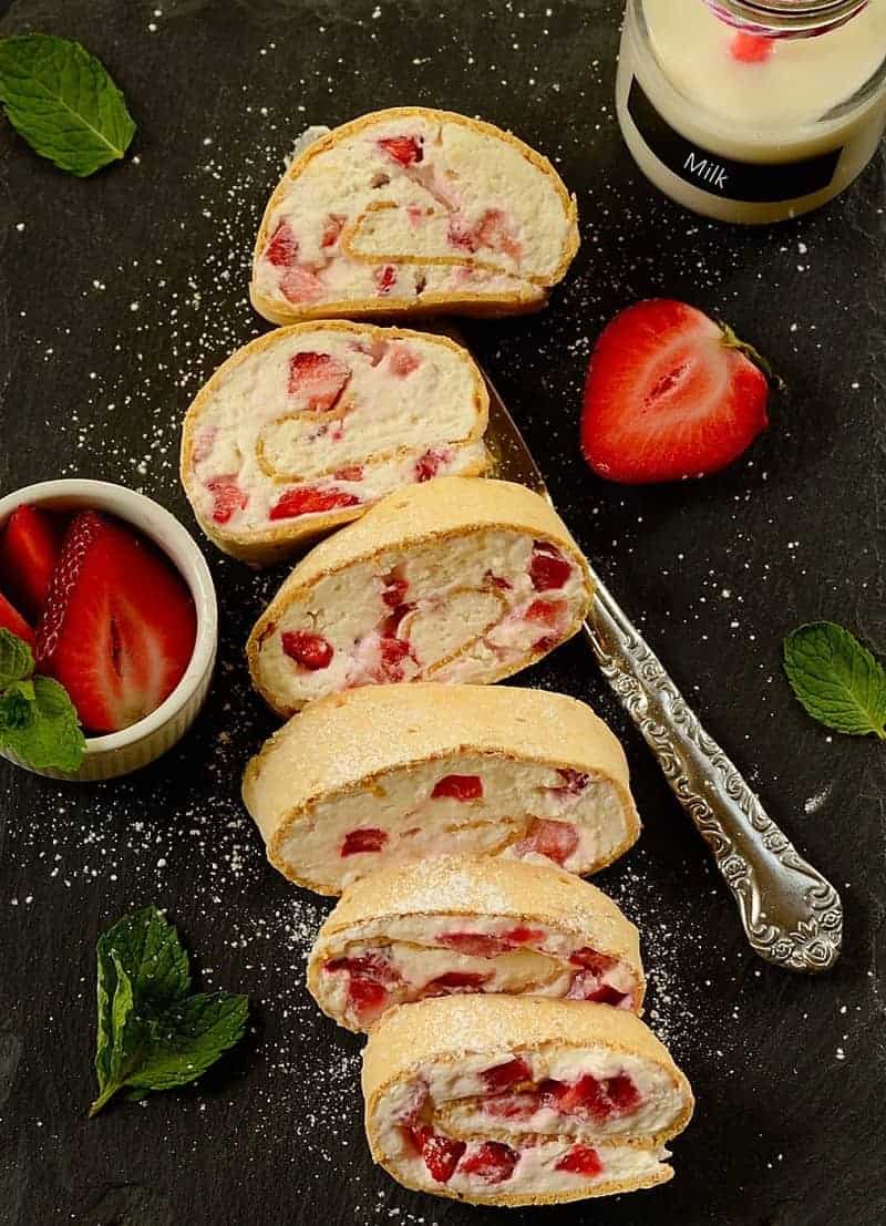 Closeup of slices of strawberry cream roll 