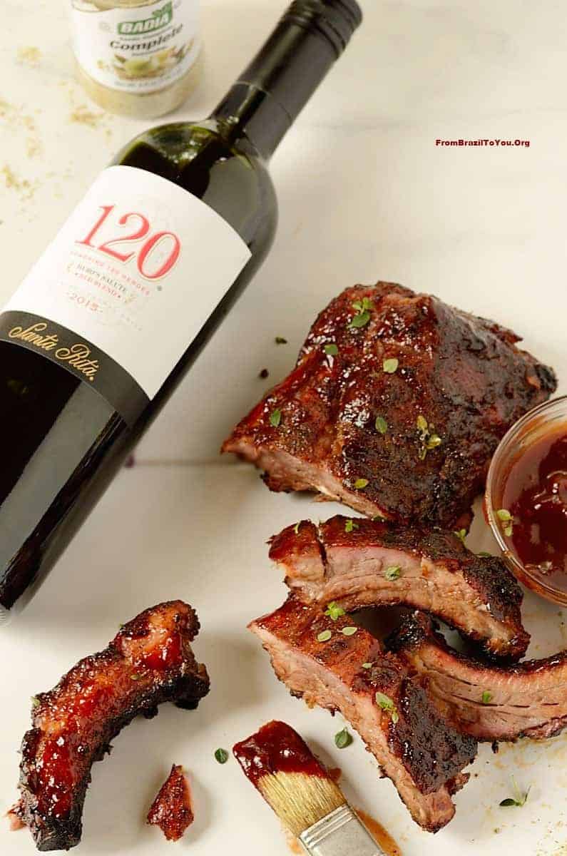 a bottle of rred wine and ribs