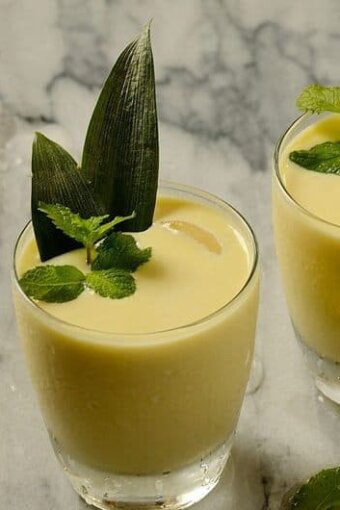 A glass of creamy pineapple coconut cocktail