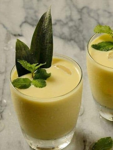 A glass of creamy pineapple coconut cocktail