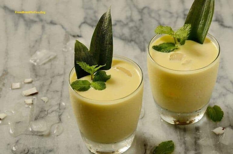 A glass of creamy pineapple coconut cocktail