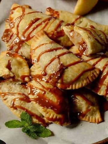 A plate of baked apple hand pies