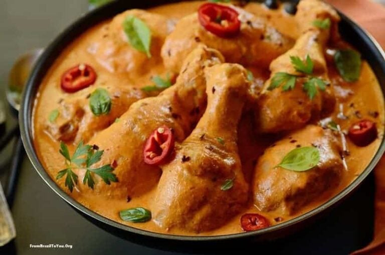 A bowl of chicken drumsticks in sauce