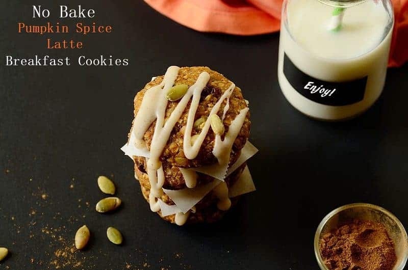 pumpkin breakfast cookies piled up with a bottle of milk on the side