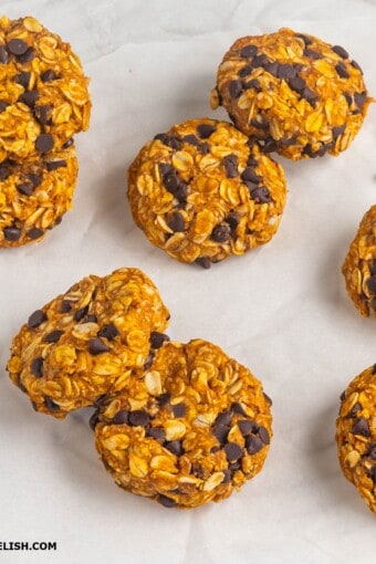 several whole pumpkin cookies on a table.