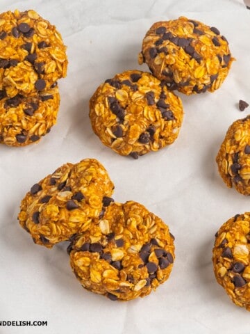 several whole pumpkin cookies on a table.