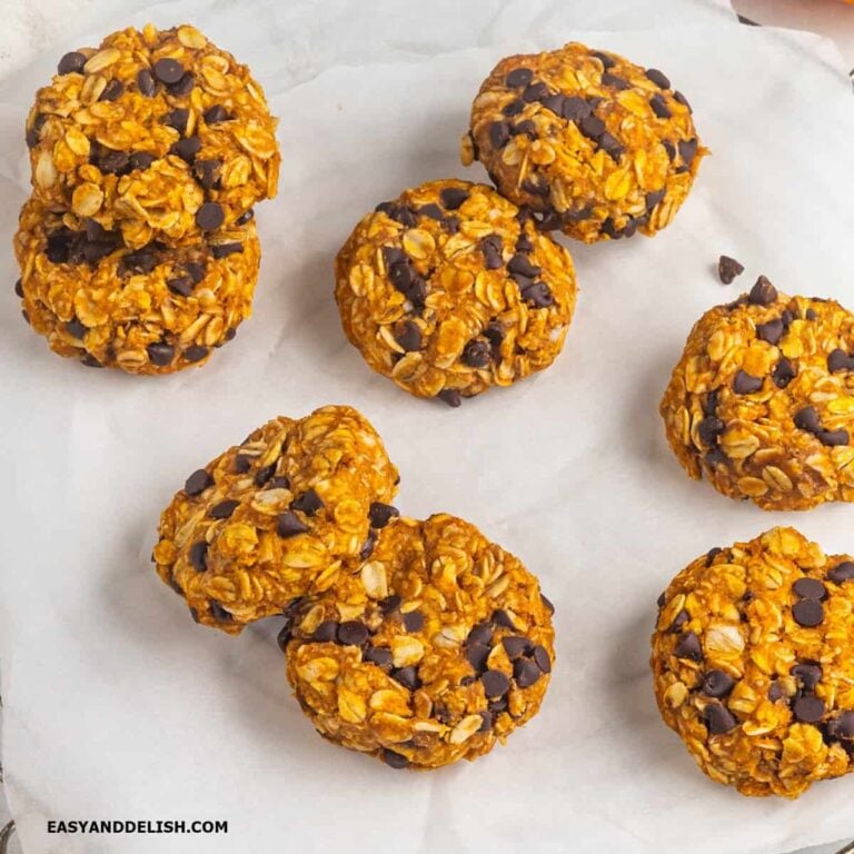several whole pumpkin cookies on a table.