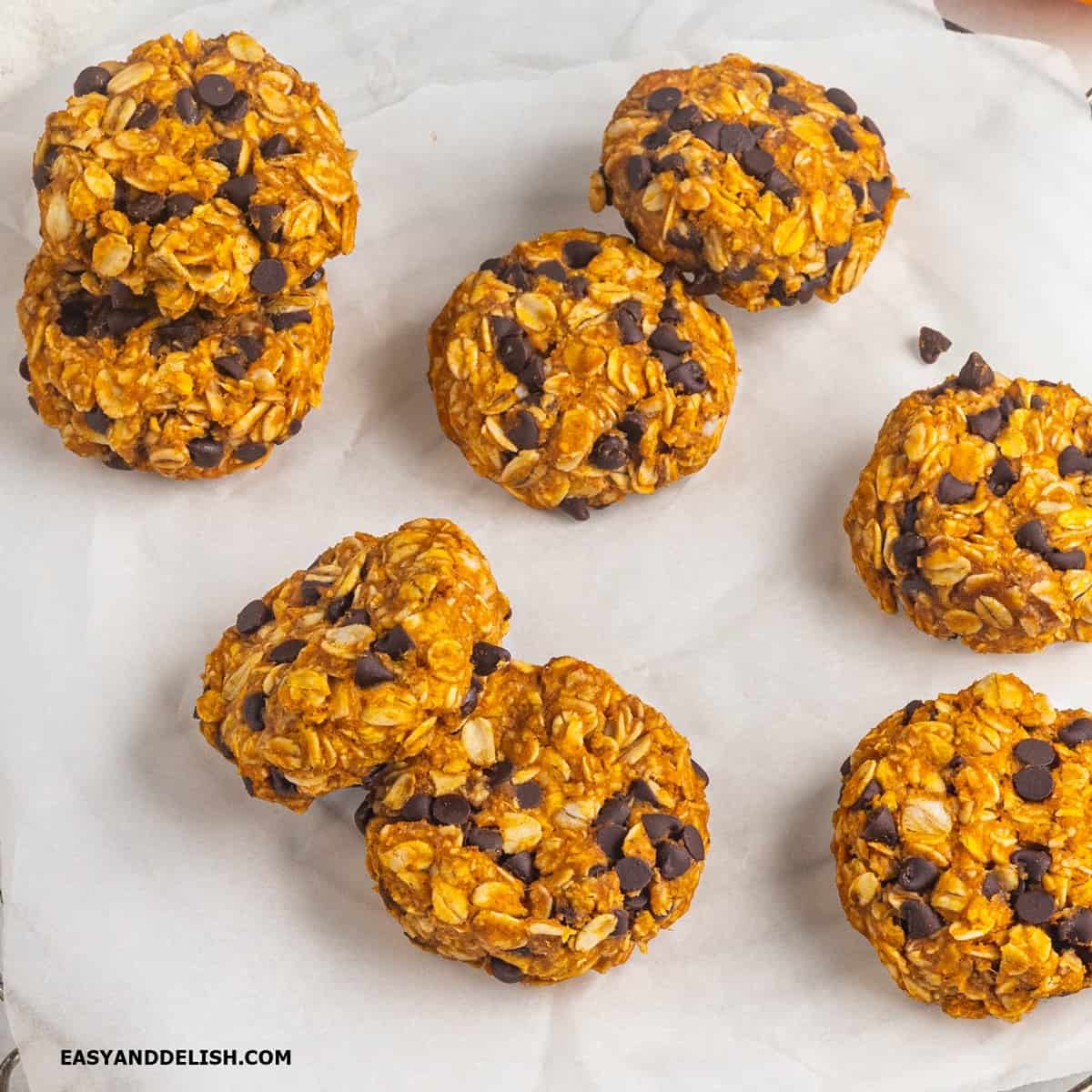 several whole pumpkin cookies on a table.