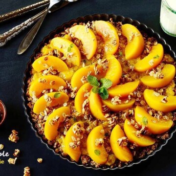 a plate of peach pie on a table