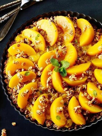 a plate of peach pie on a table