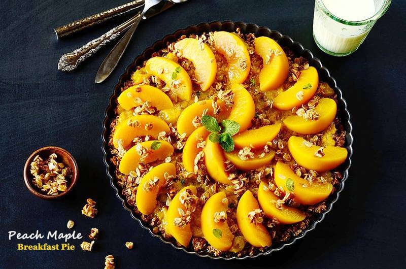 a plate of peach pie on a table