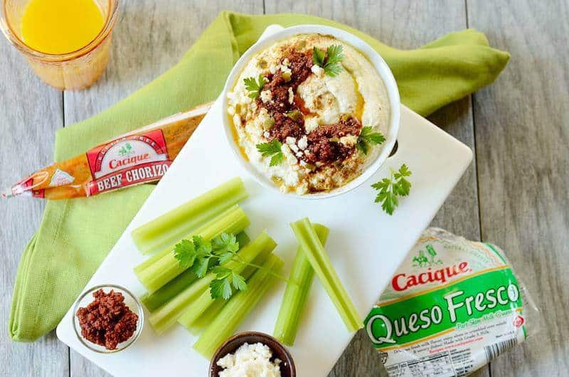 cacique products on the side of a low carb hummus with celery sticks on the side 