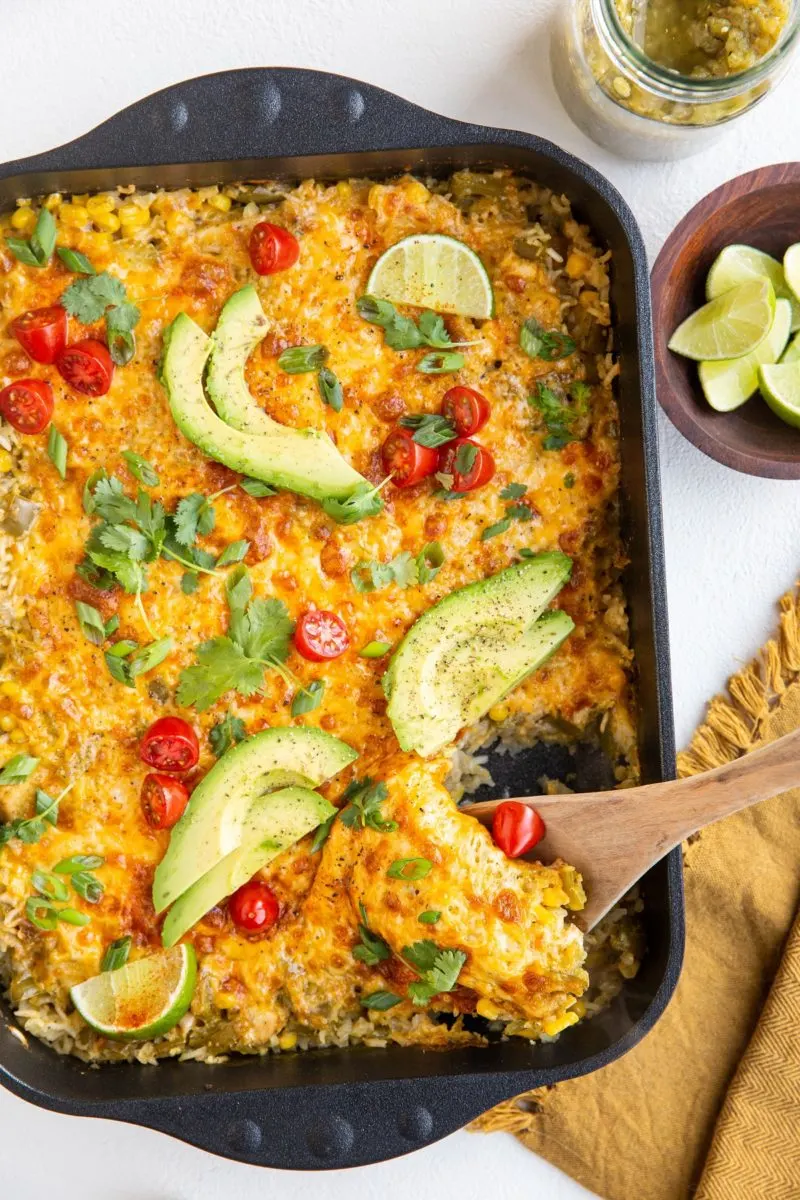 Salsa verde casserole with garnishes on top and around -- by The Roasted Root