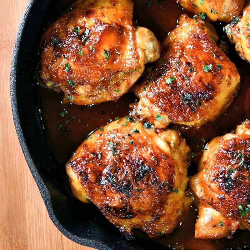 Sweet and Spicy Thighs in a skillet by 24 Bites 