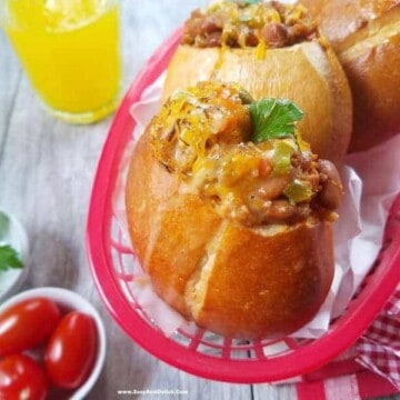 A plate of sandwiches and a bowl of tomatoes