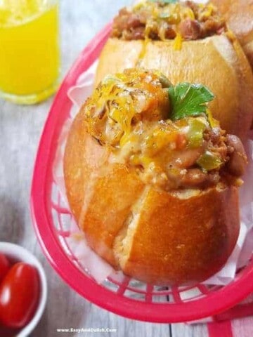 A plate of sandwiches and a bowl of tomatoes