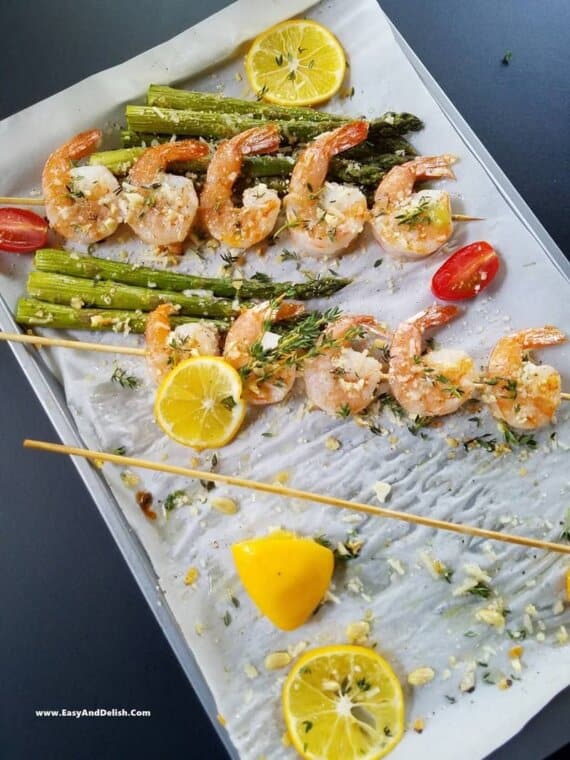 shrimp and asparagus skewers partially eaten