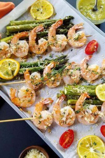 Parmesan shrimp skewers ina  baking sheet