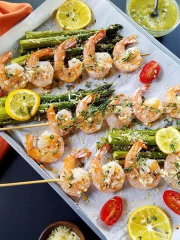 Parmesan shrimp skewers ina  baking sheet