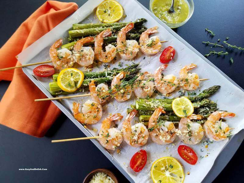 Parmesan shrimp skewers ina  baking sheet