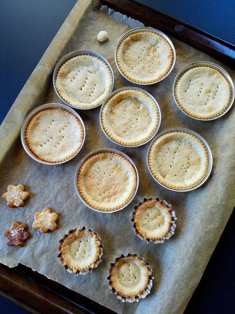 tart shells after being baked in a baking sheet