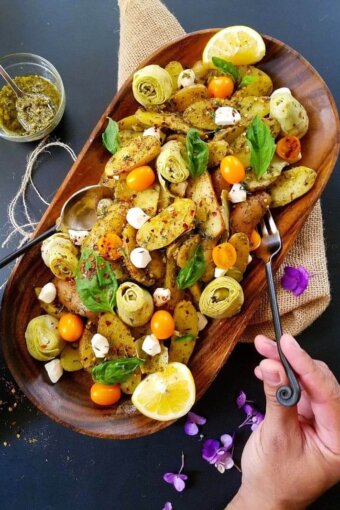 healthy potato salad in a platter with silverware on the sides