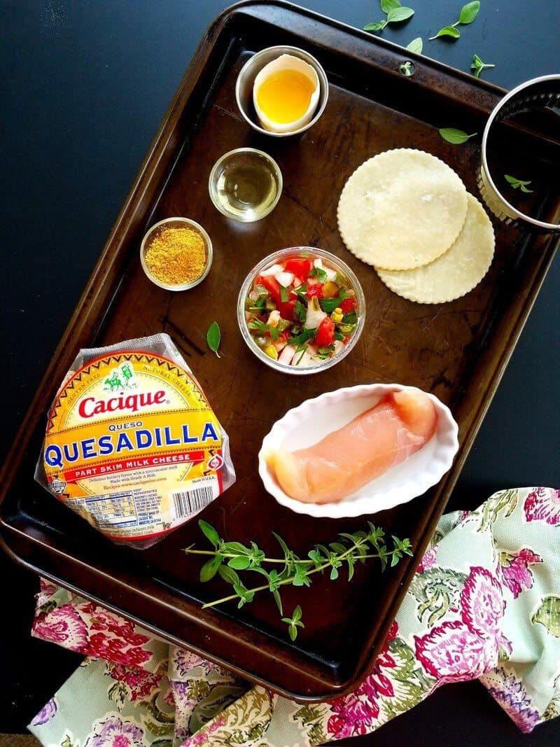 Food on a table, with ingredients for Empanadas