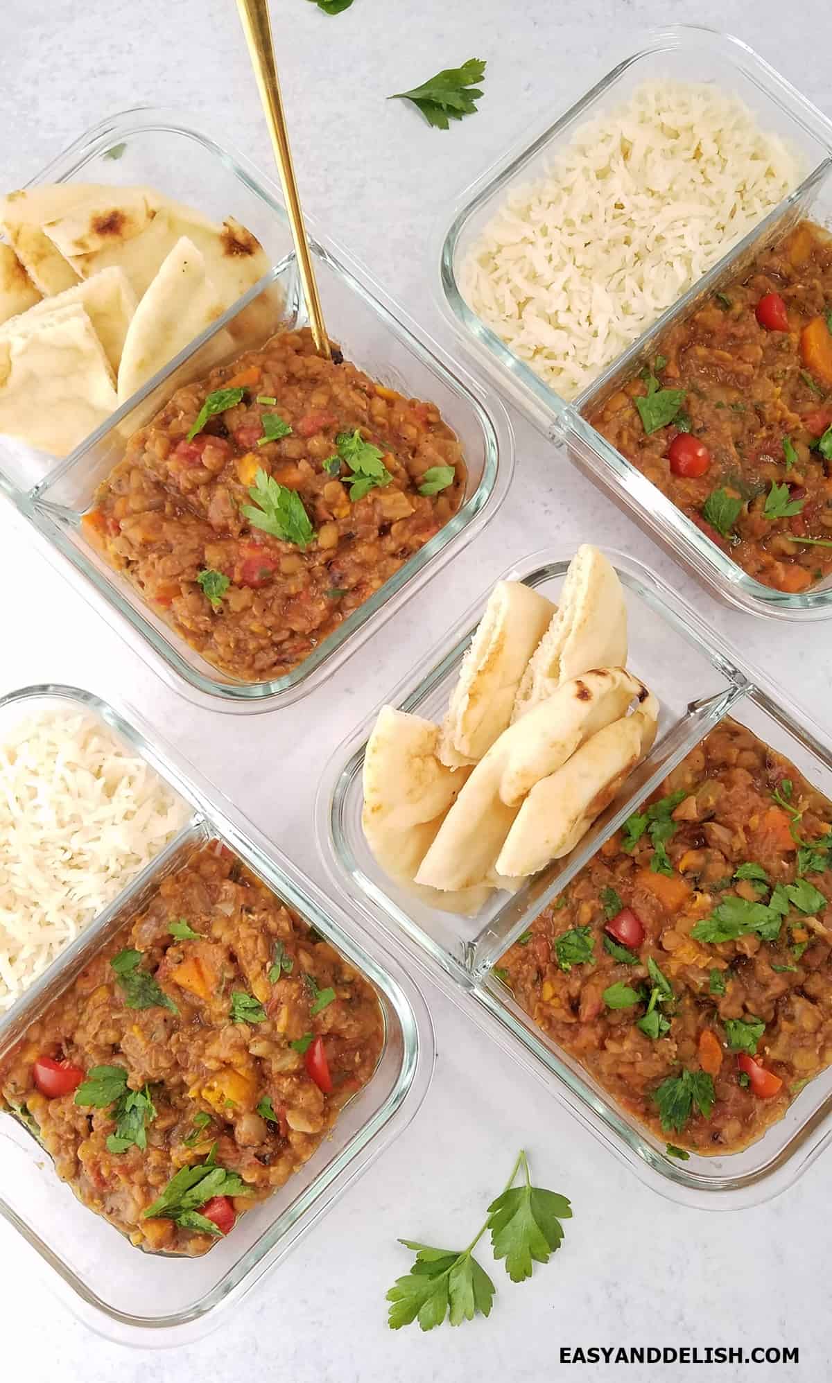 Meal prep containers with food portioned for lunch. 