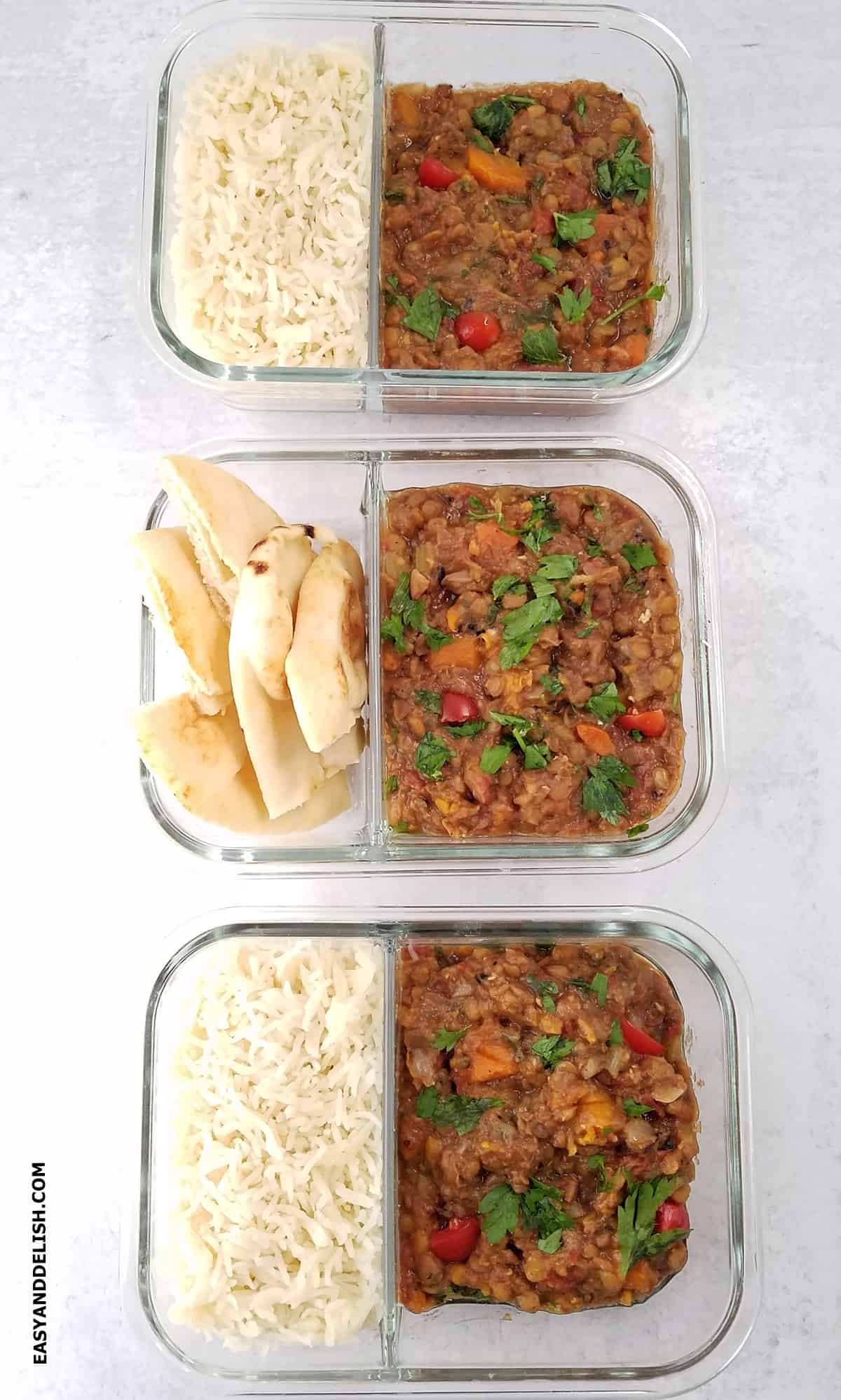 Rice, naan, and plant-based stew portioned into meal prep containers. 