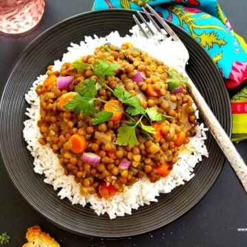 easy lentil curry served over rice in a plate