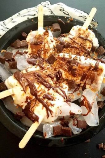 A plate of popsicles on a table