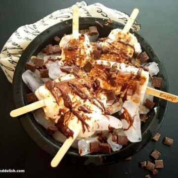 A plate of popsicles on a table