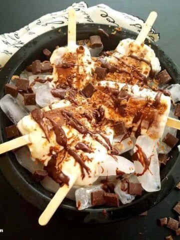 A plate of popsicles on a table