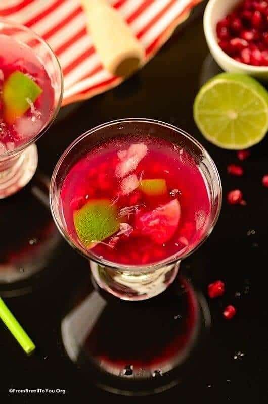 Pomegranate caipirinha cocktail in a glass to be enjoyed as one of the new year's eve cocktails.