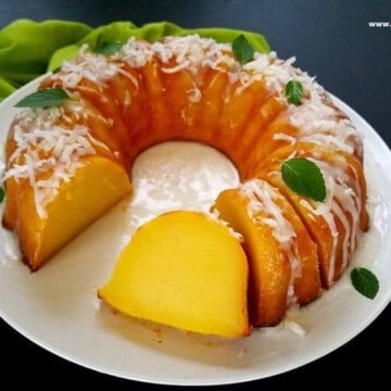 magic custard cake partially sliced in a plate