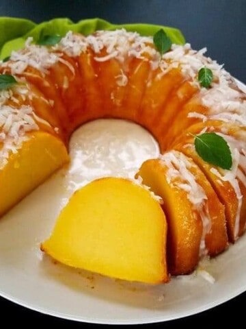 magic custard cake partially sliced in a plate