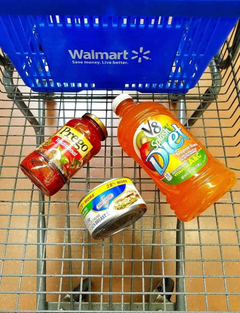 A close up of a supermarket cart with products