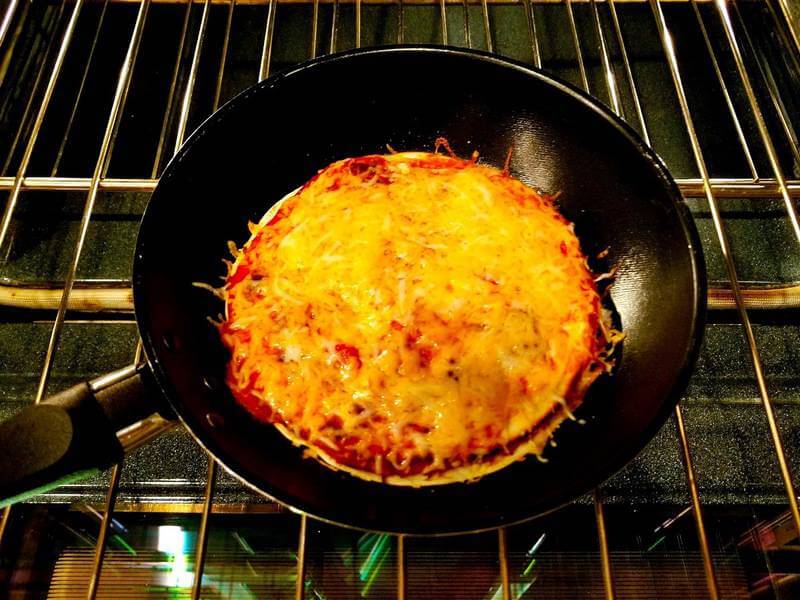 cooking pizzadilla in a skillet