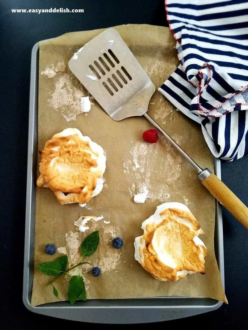 meringues on a baking sheet after being baked