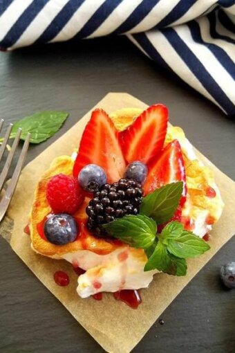 berry cloud eggs over a square of parchment paper