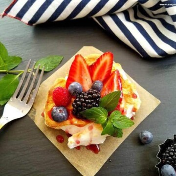 berry cloud eggs over a square of parchment paper