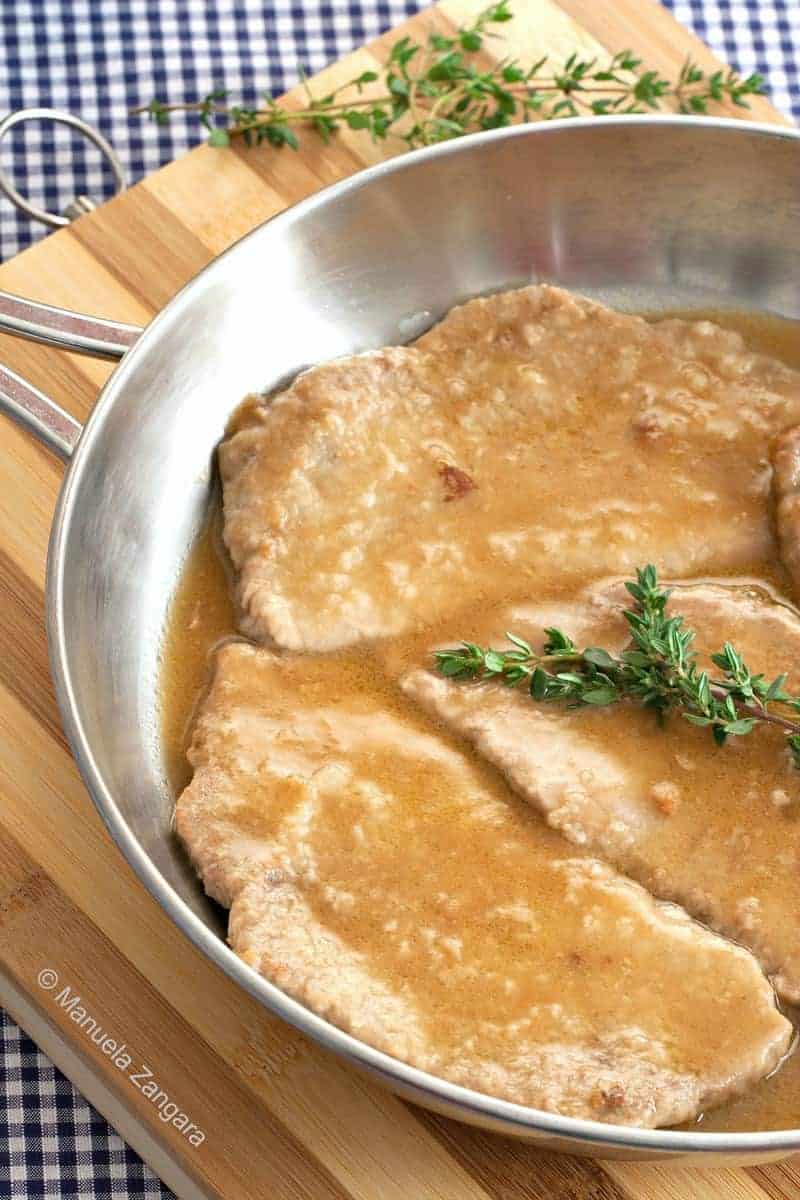 Close up of half skillet of Italian veal marsala.