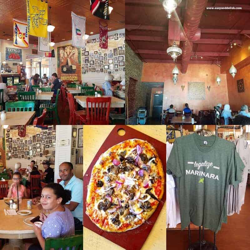 A group of people sitting at a table with a pizza in a restaurant